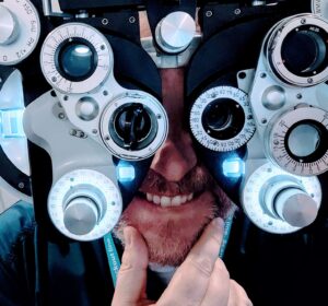 Man behind refractor is unsure which lens is best.